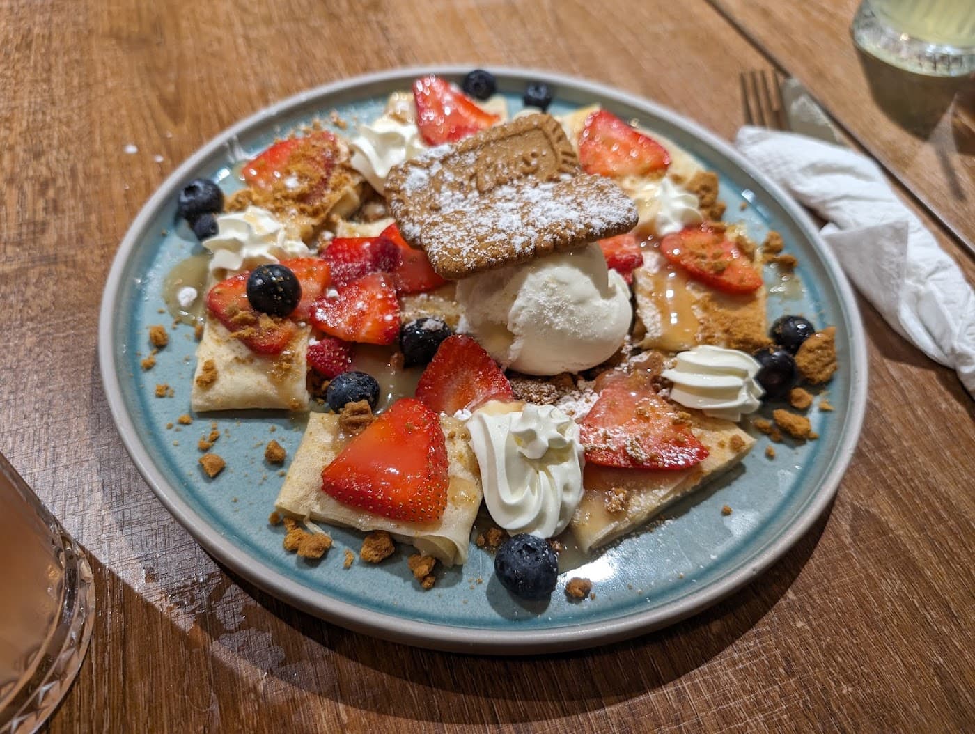 Rabbit Hole - Freshly made sweet crepes topped with fresh fruit, whipped cream, and a Lotus Biscoff biscuit